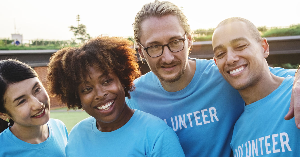 Group of happy and diverse volunteers
